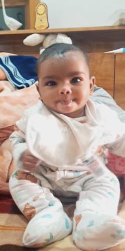 Vyomika — sitting up, judging gently